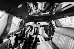 Bride and groom in limo