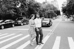 Manhattan engaged couple crossing the street