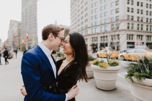 Flatiron engaged couple kissing
