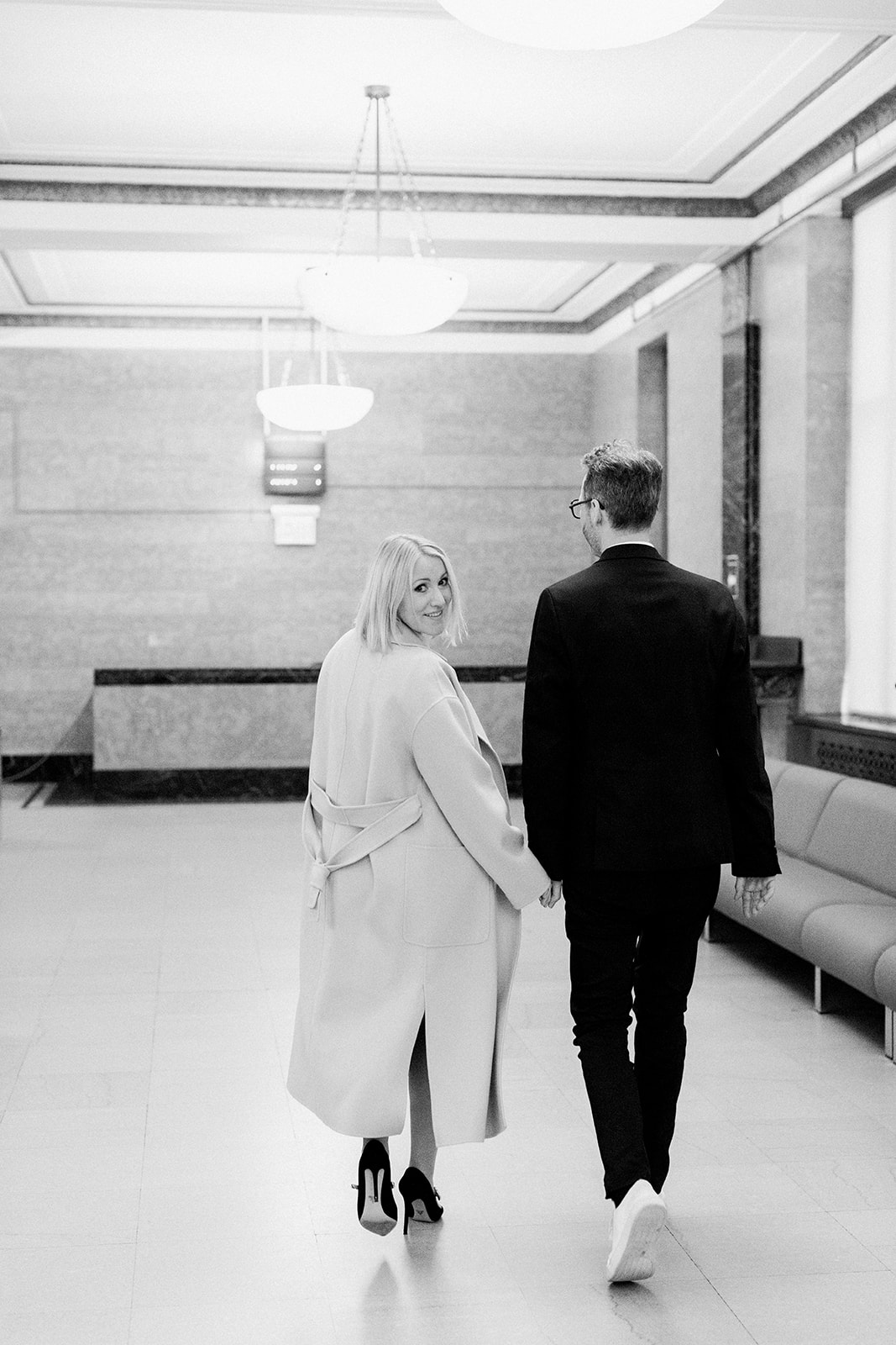 bride and groom leaving NYC city hall