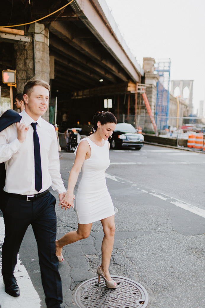 a man and a woman walking hand in hand in NYC for their NYC elopement photography