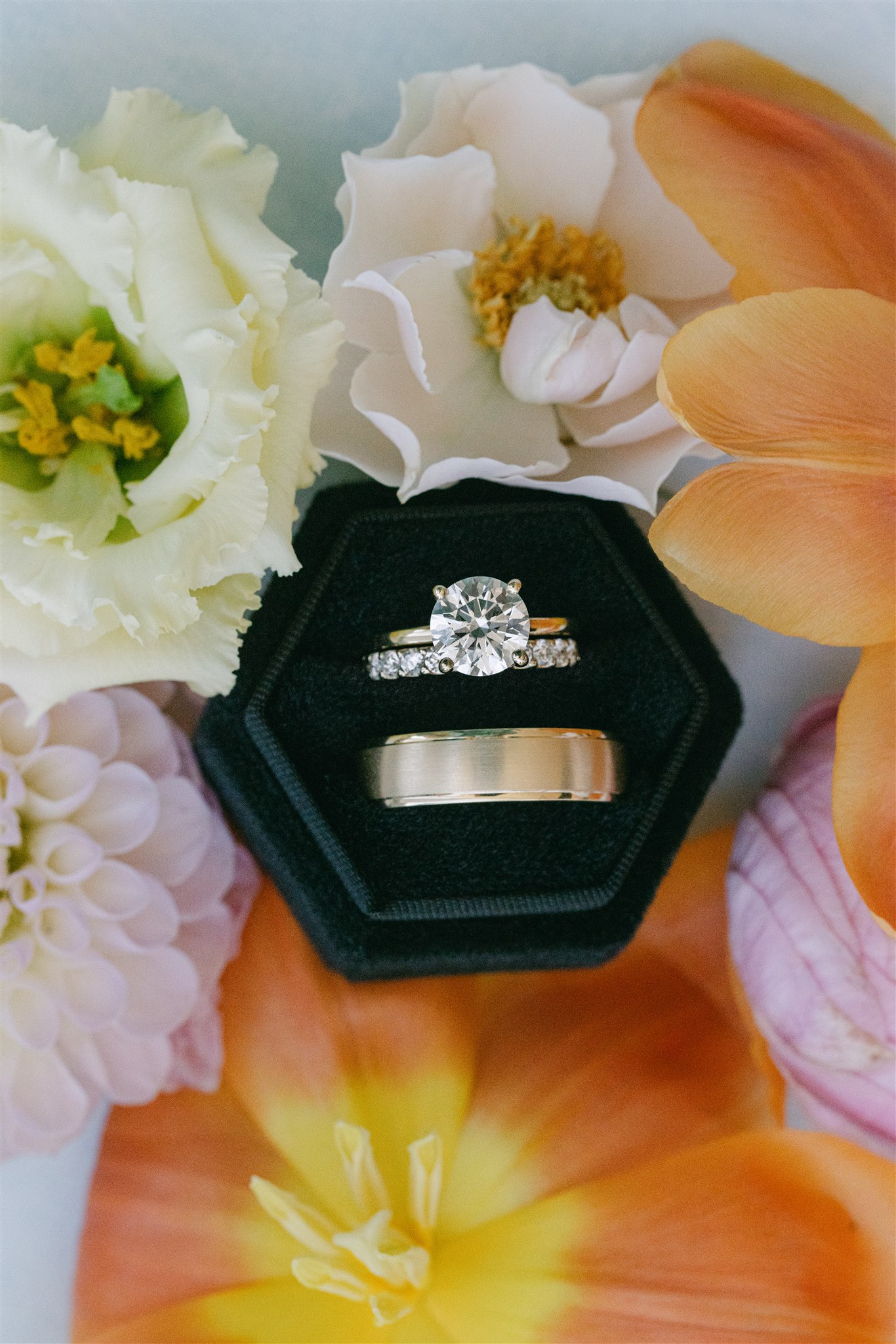 Wedding rings surrounded by flowers