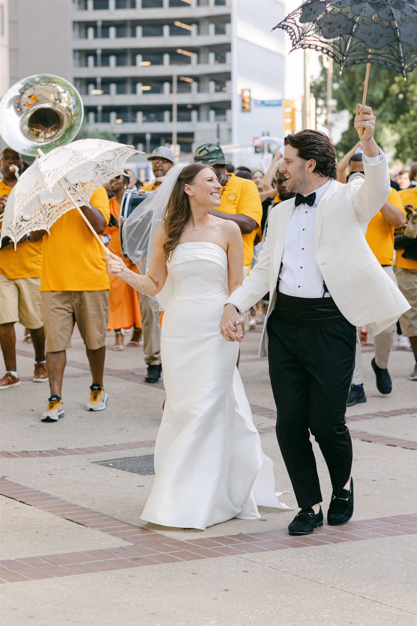 bride and groom with the second line band