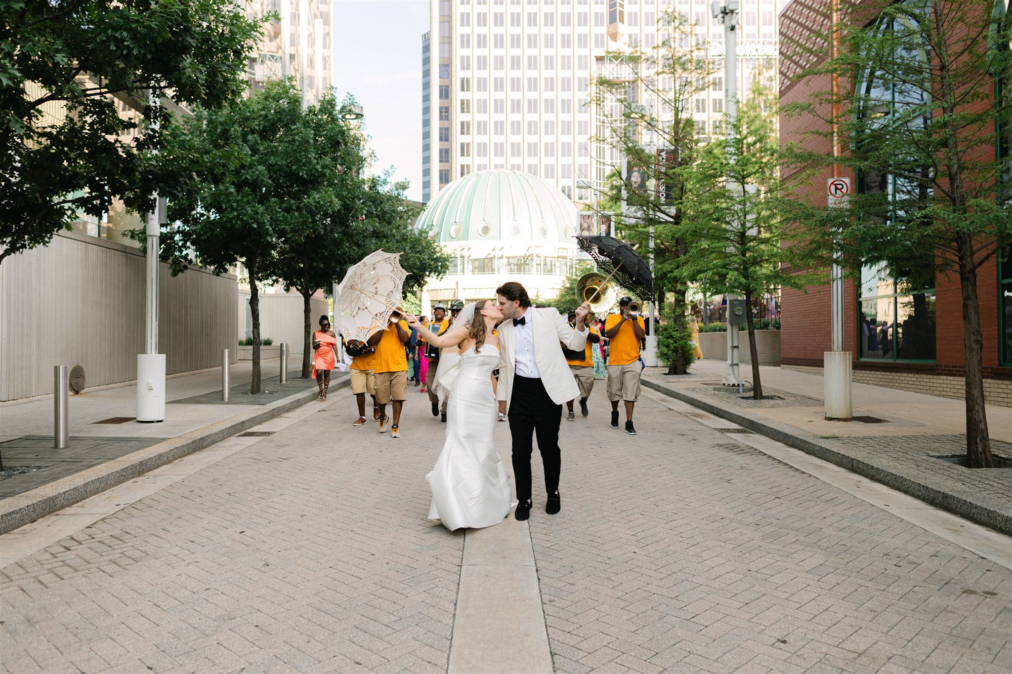 bride and groom with the second line band