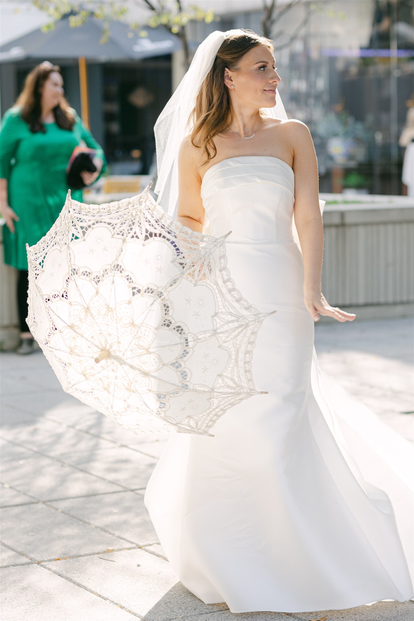 bride with a white parasol