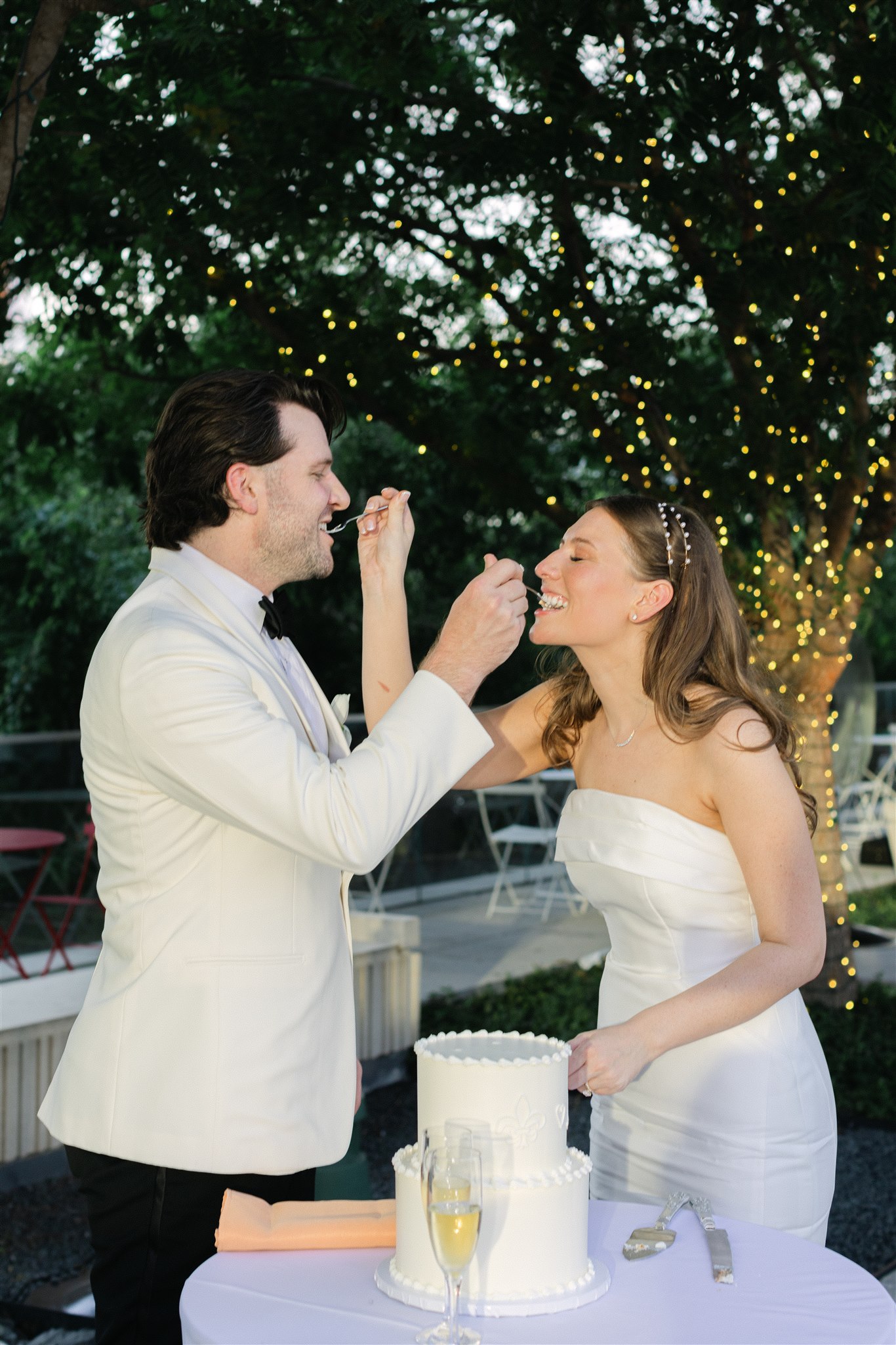 bride and groom cutting the cake