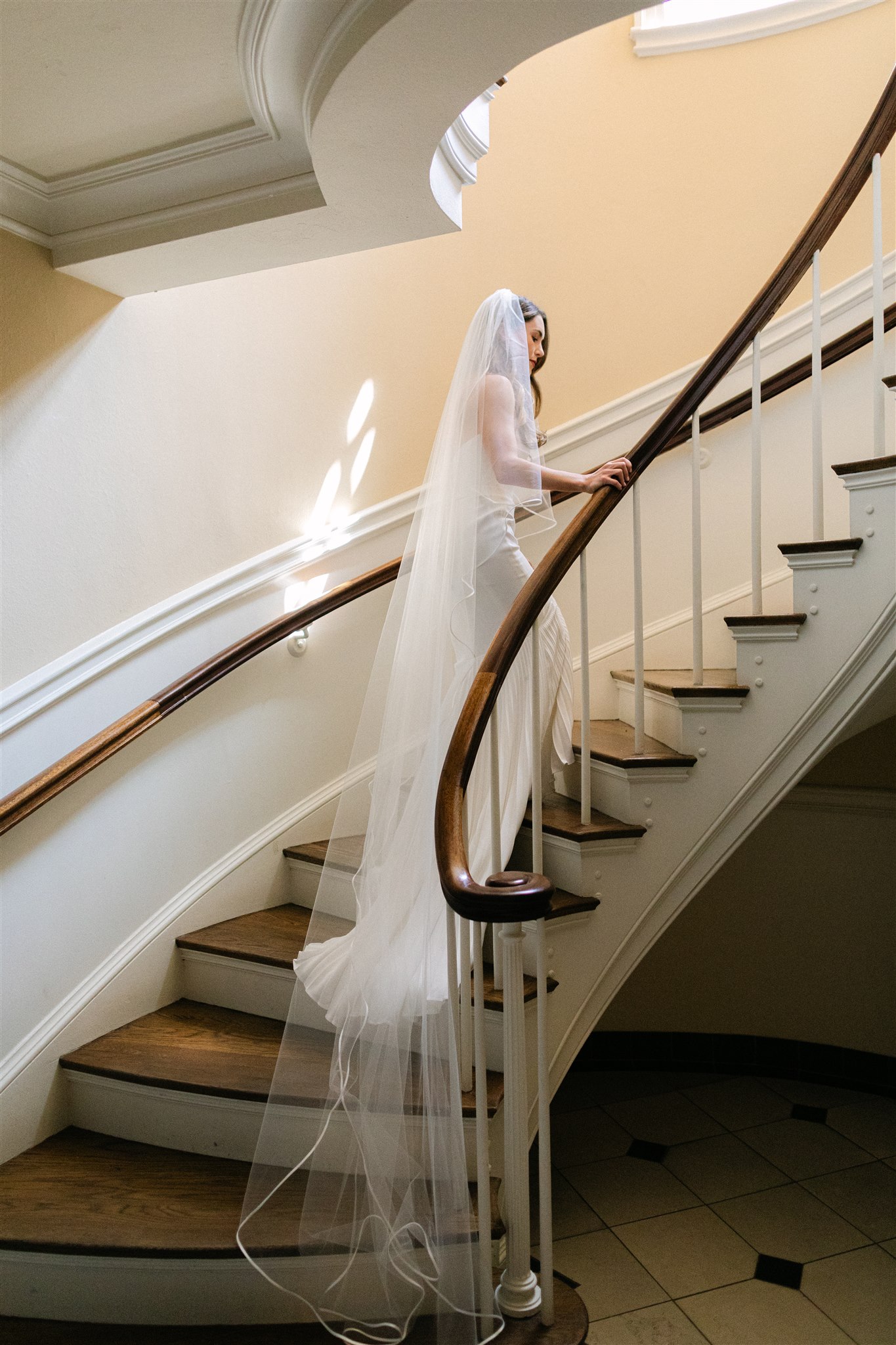 bride walking up a staircase