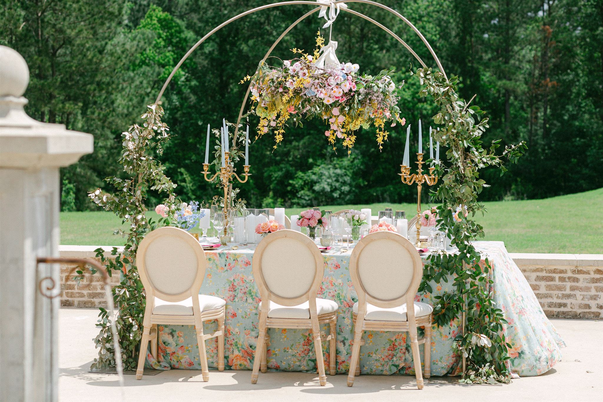 beautiful wedding reception table with lots of flowers