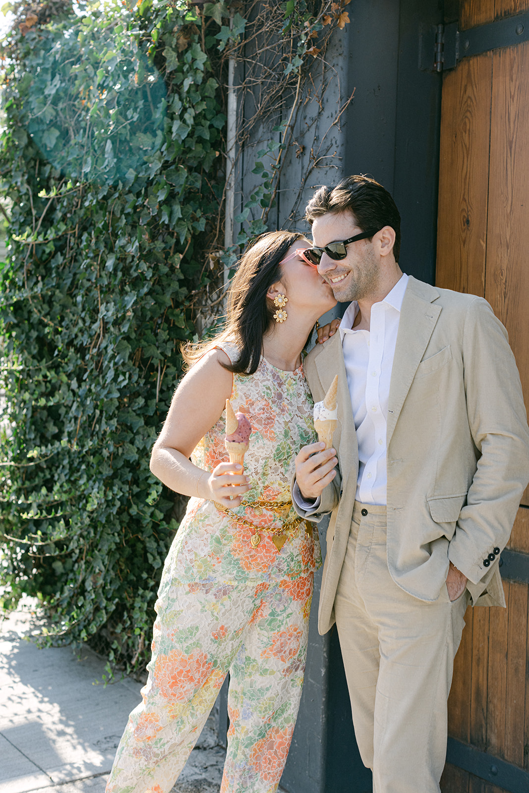 Man & a woman eating ice cream with sunglasses on