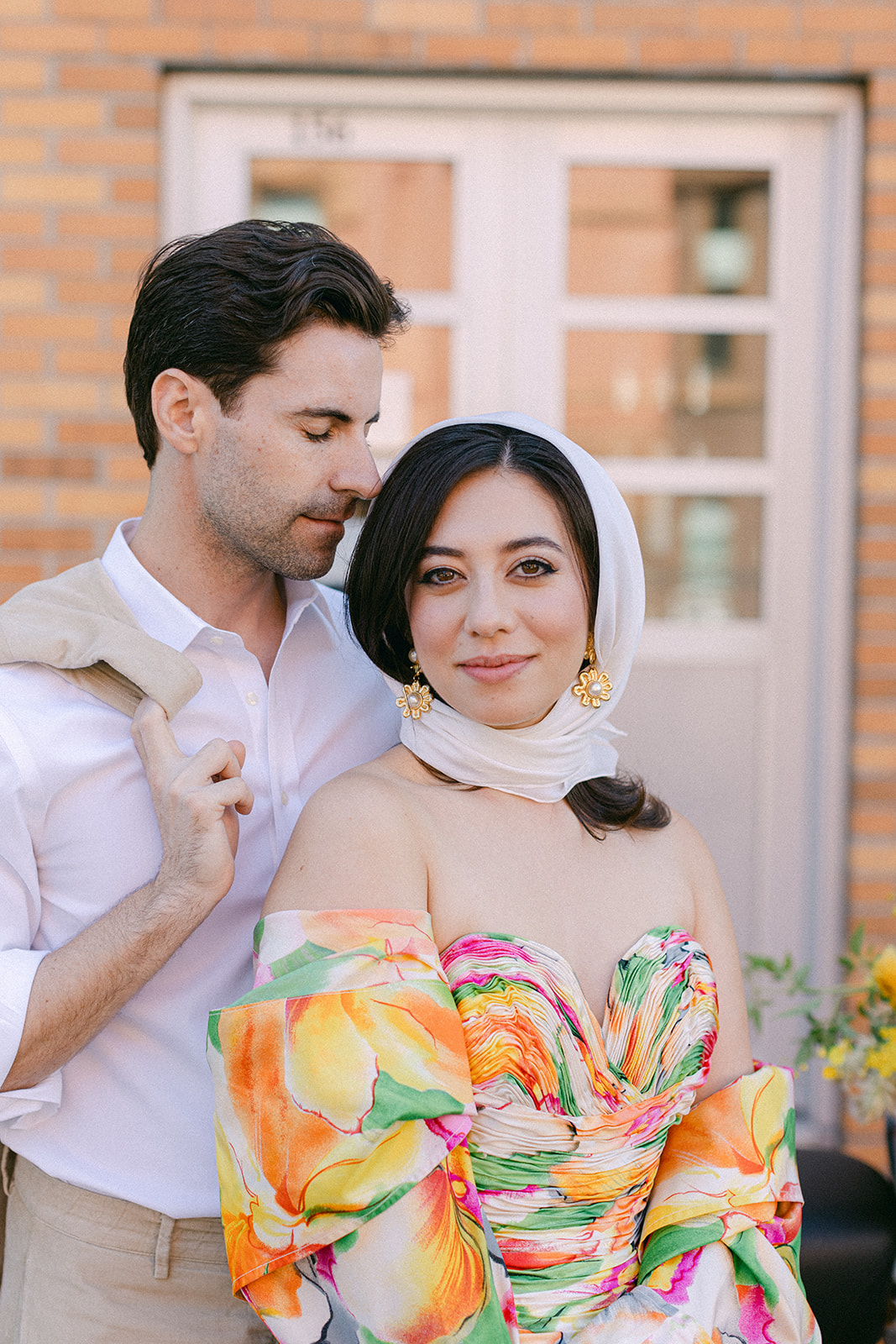 bride and groom in front of a vespa after their European inspired elopement in NYC