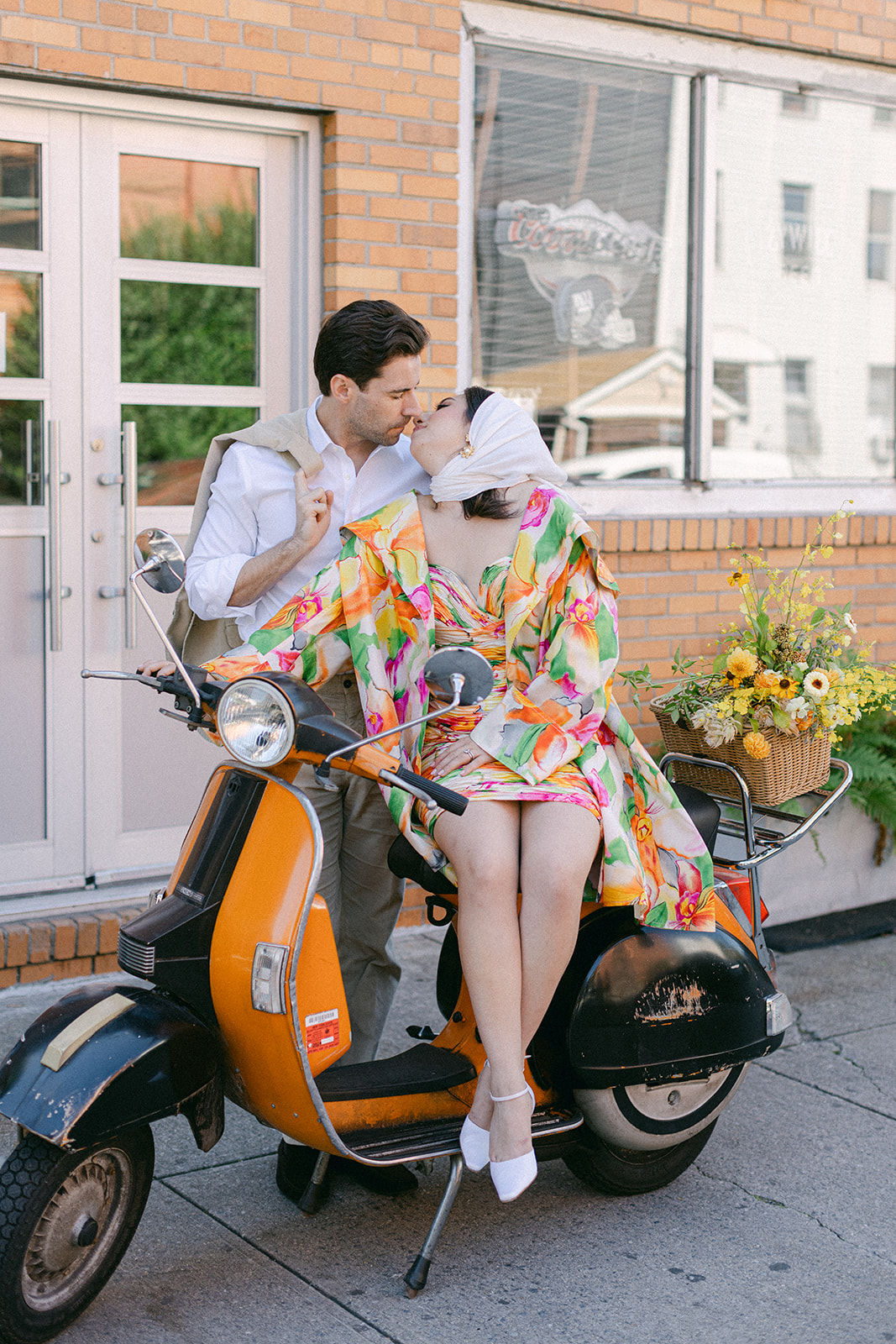 bride and groom in front of a vespa after their European inspired elopement in NYC