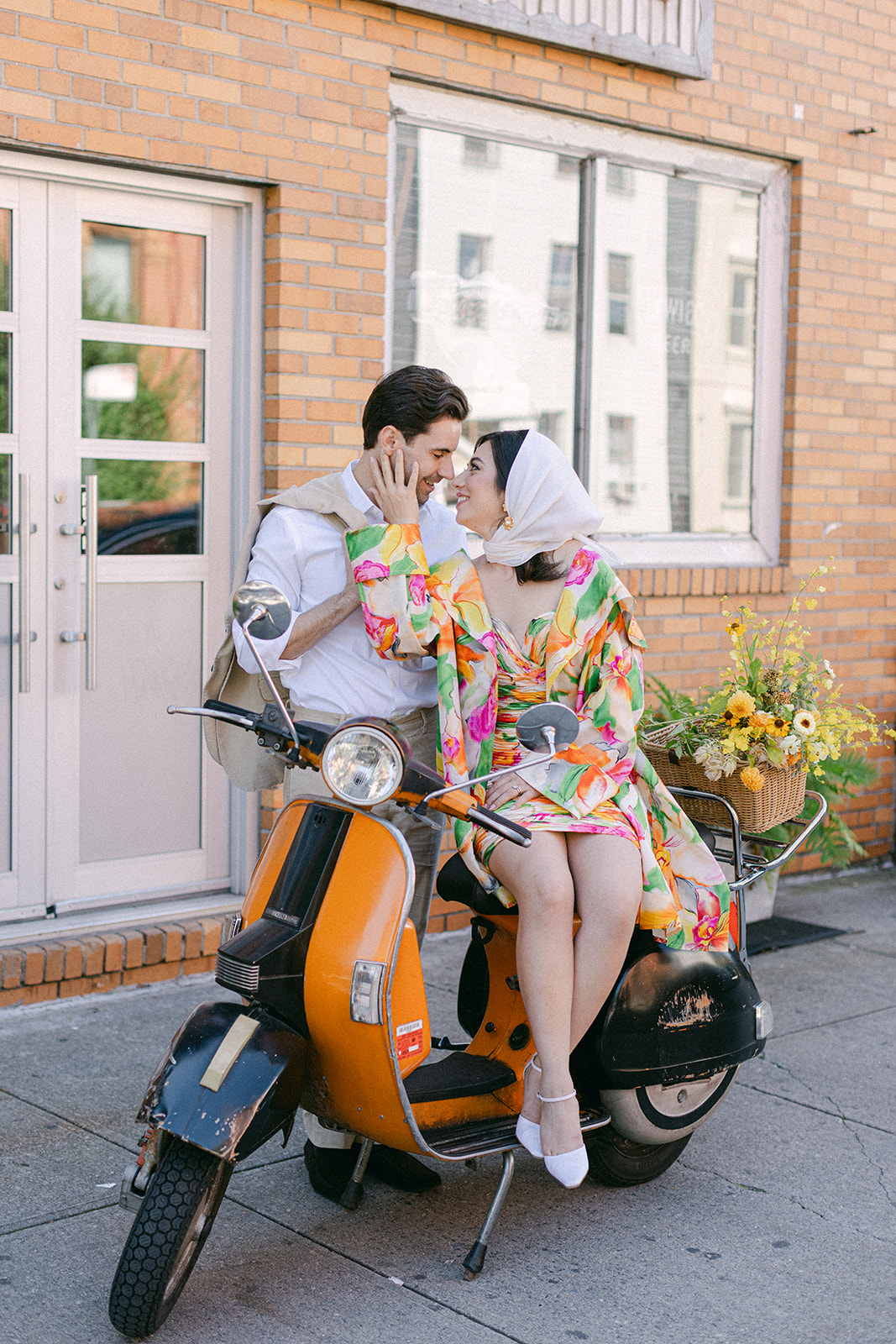 bride and groom in front of a vespa after their European inspired elopement in NYC