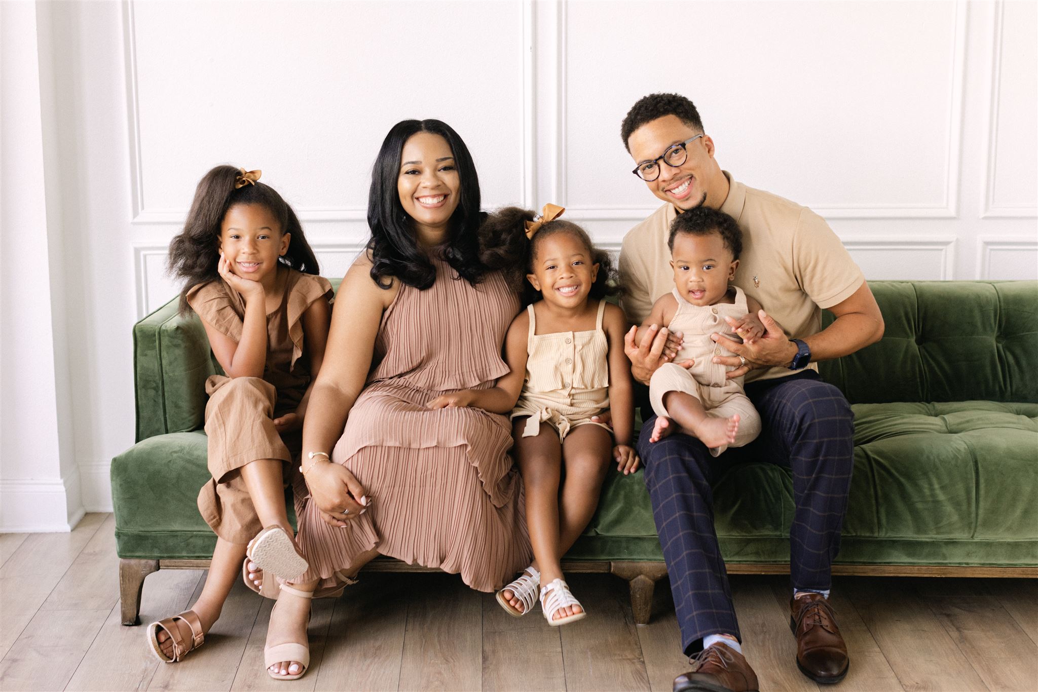 A couple with their 3 kids at The Lumen Room Lifestyle in Dallas, Texas