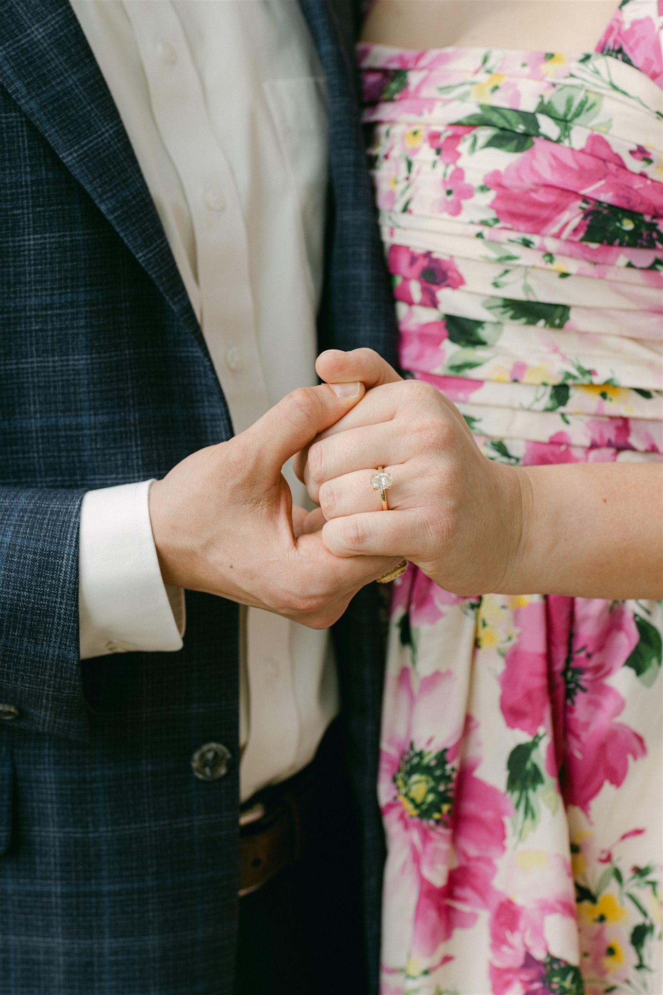 A couple holding hands during their engagement session in Dallas