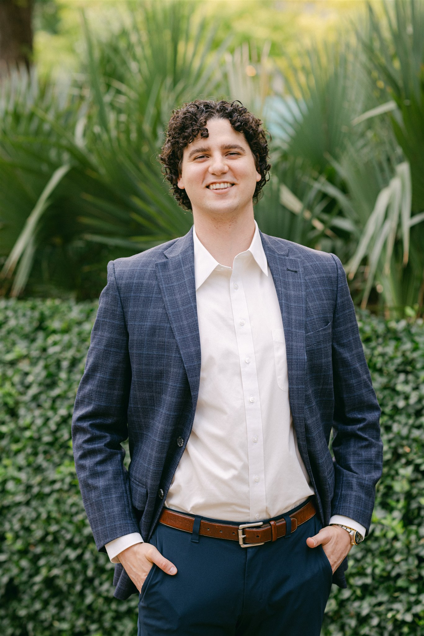 A man wearing a suit for his engagement photos in dallas