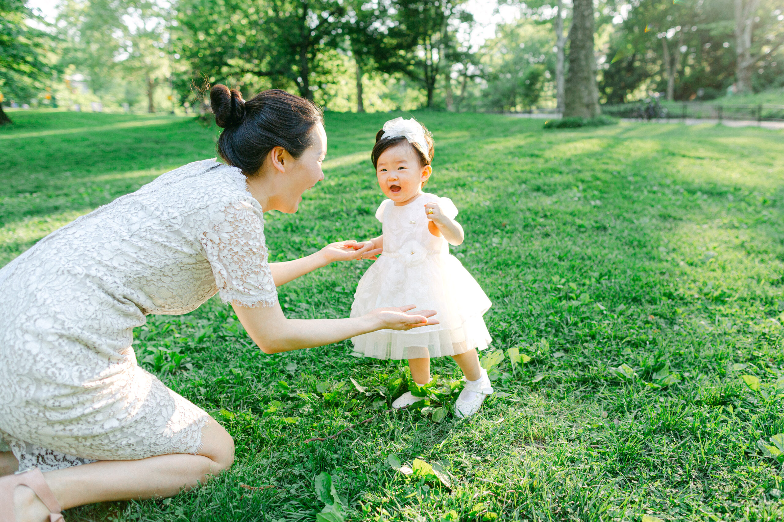 A baby walking to her mother