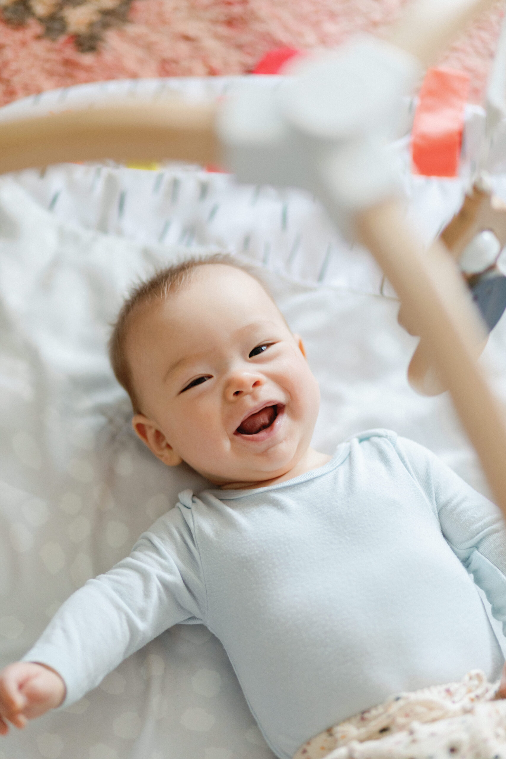 A baby laughing and smiling