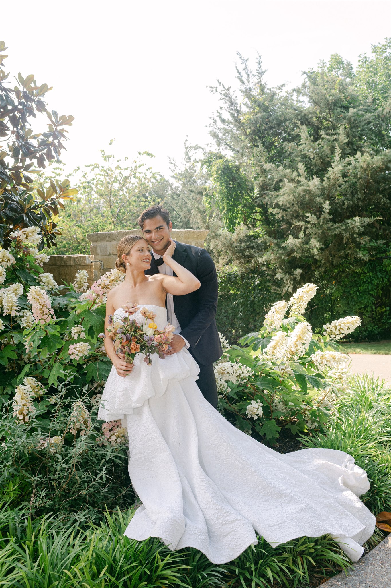 wedding couples portraits in flowers at the dallas arboretum