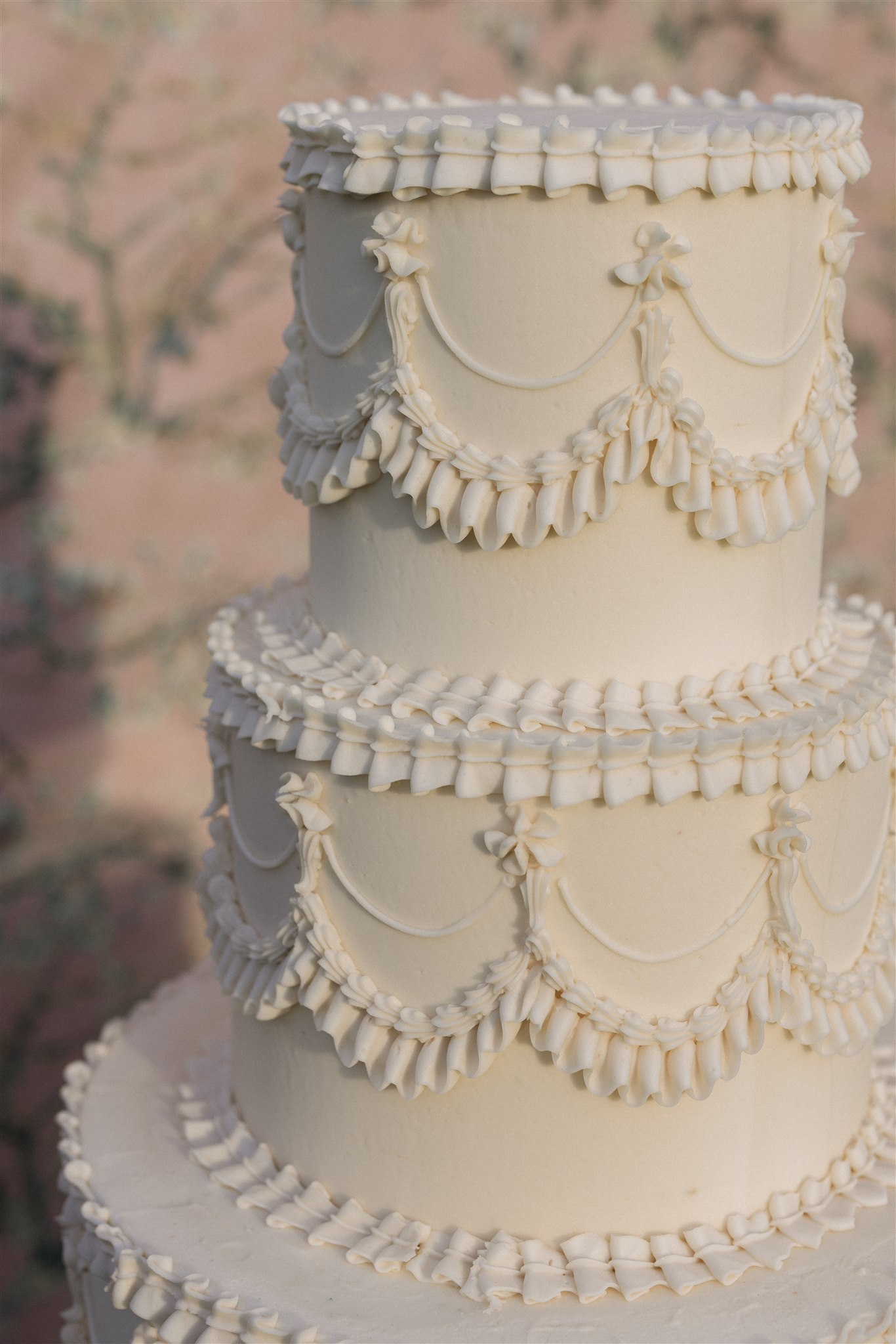 A lambeth style 3 tiered wedding cake for a wedding reception at the Dallas arboretum