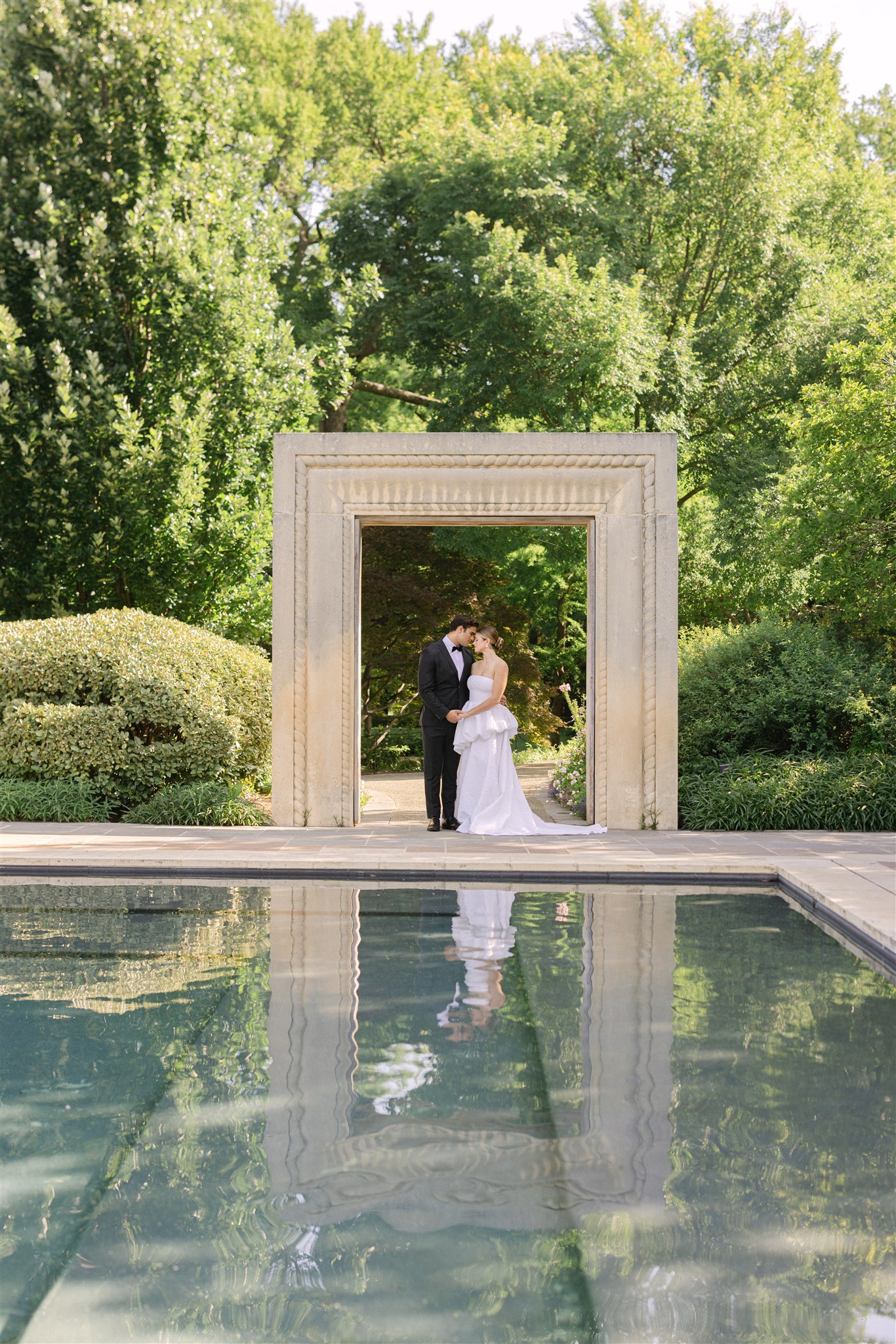 wedding couple portraits in the womens garden at the dallas arboretum
