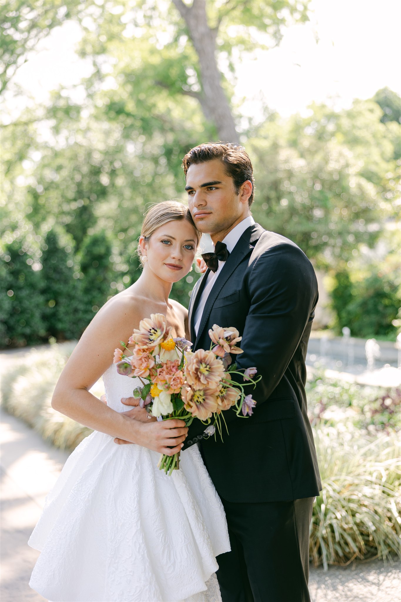 Wedding couple portraits in front of camp house at the dallas arboretum