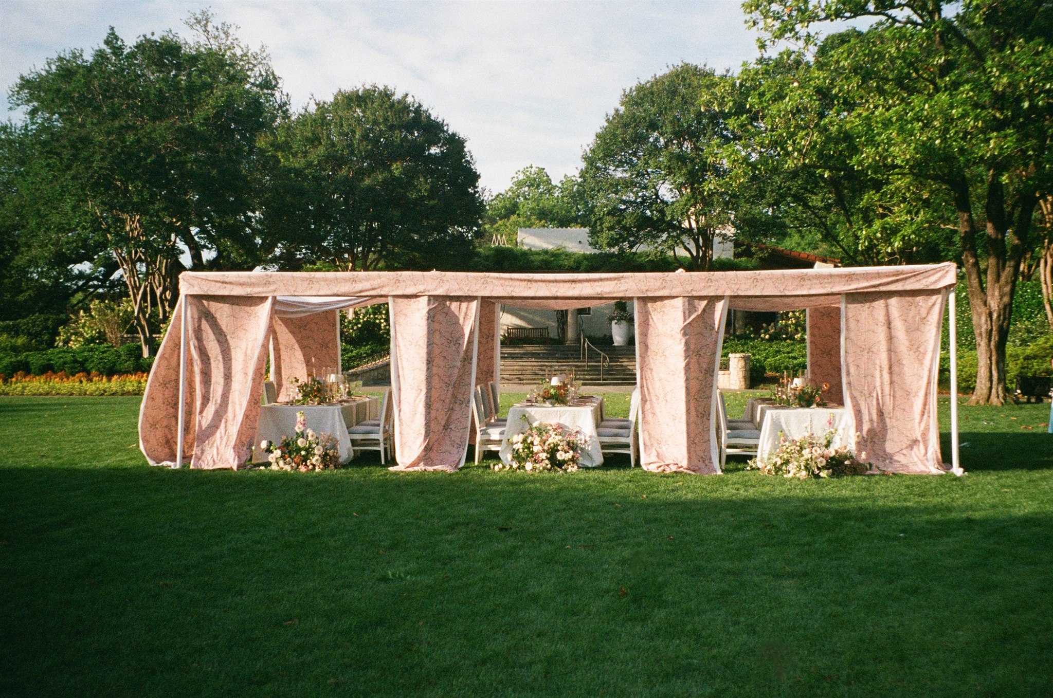 a tented wedding reception at the dallas arboretum
