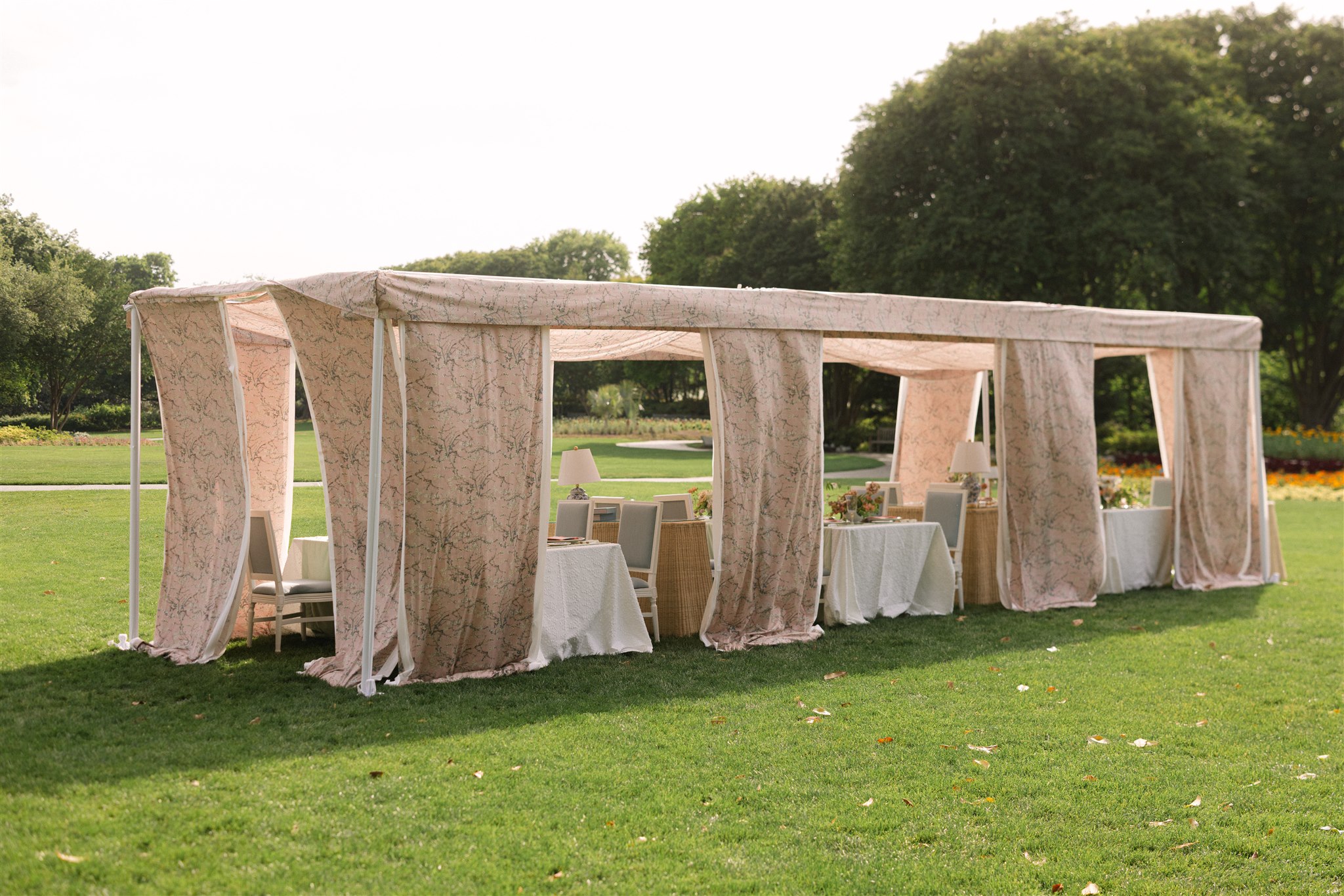 a tented wedding reception at the dallas arboretum