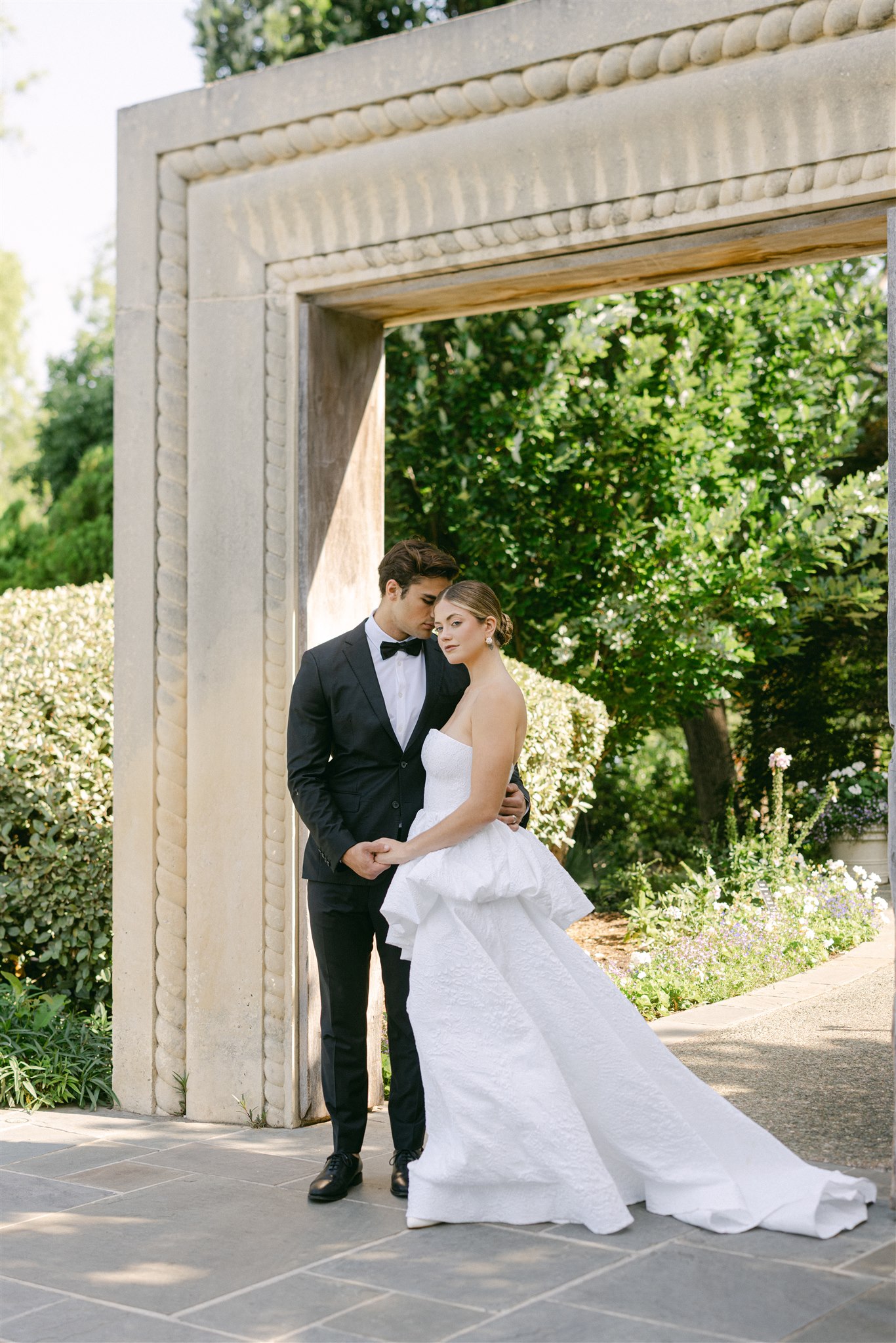 wedding couple portraits in the womens garden at the dallas arboretum