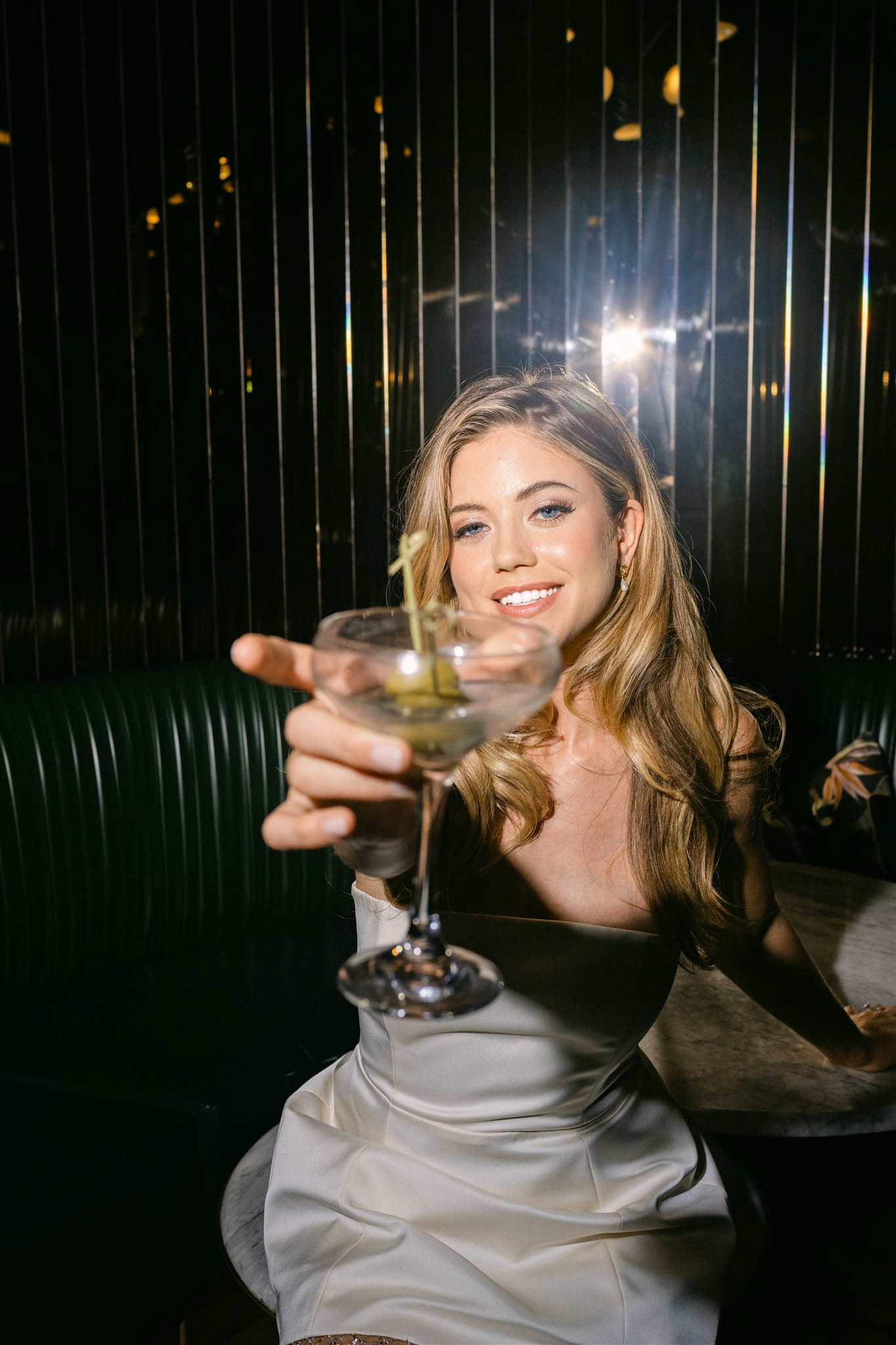 a bride holding a martini