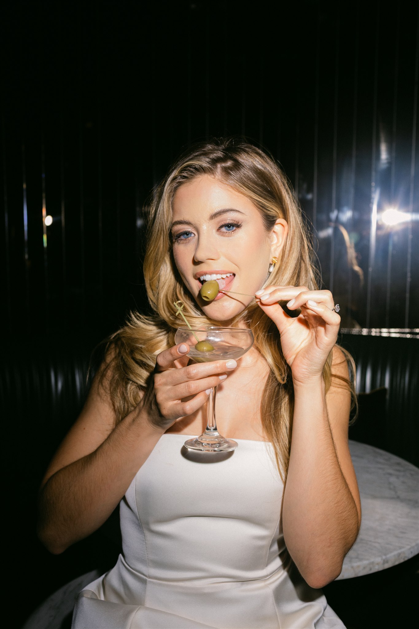 a bride holding a martini
