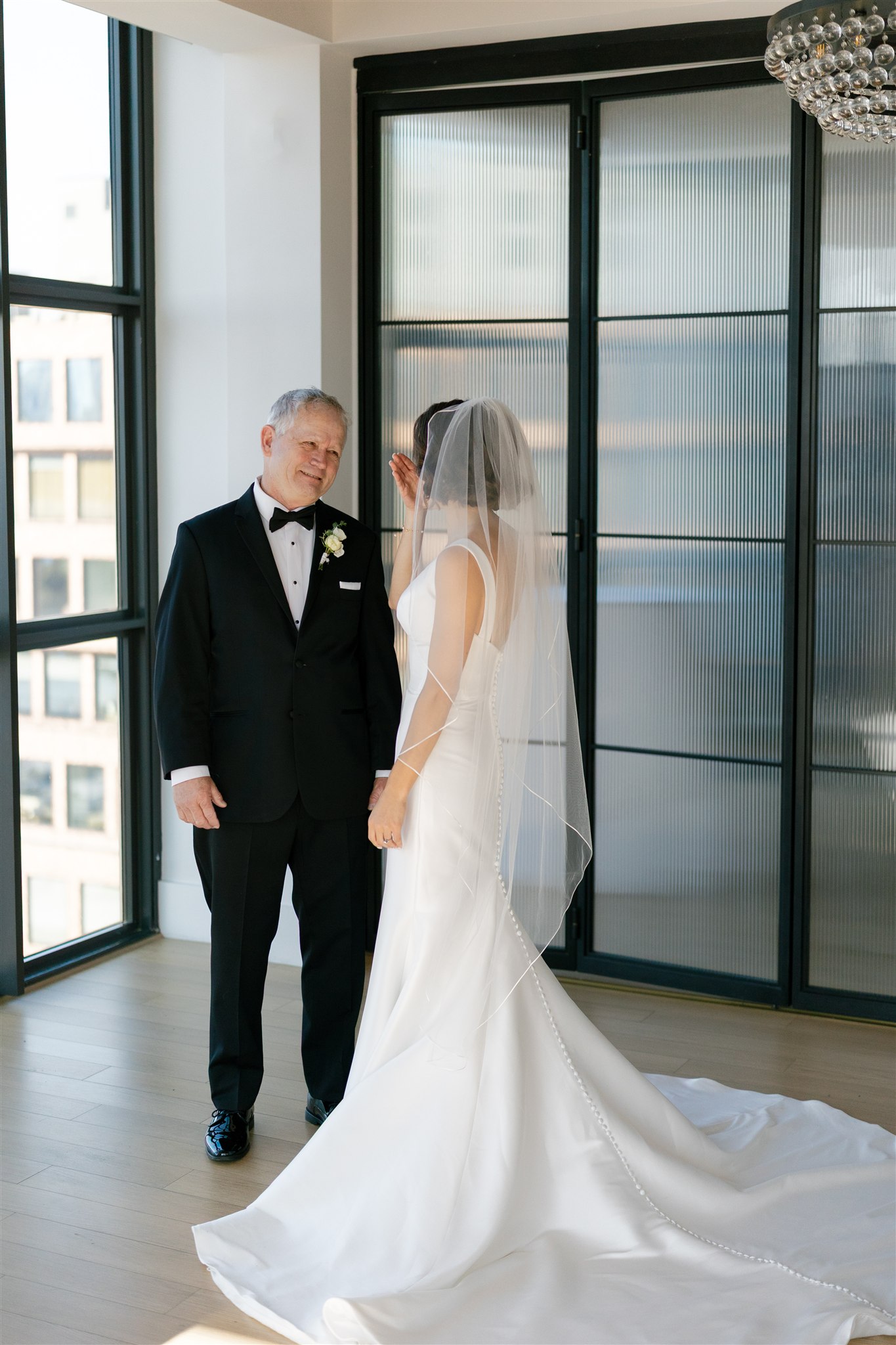a brides first look with her dad before her wedding day