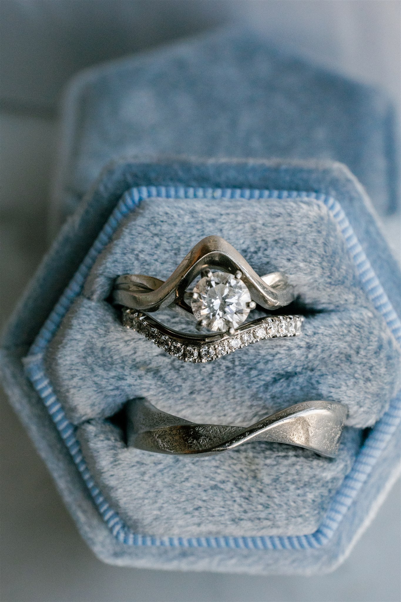close up photos of an engagement ring and wedding band