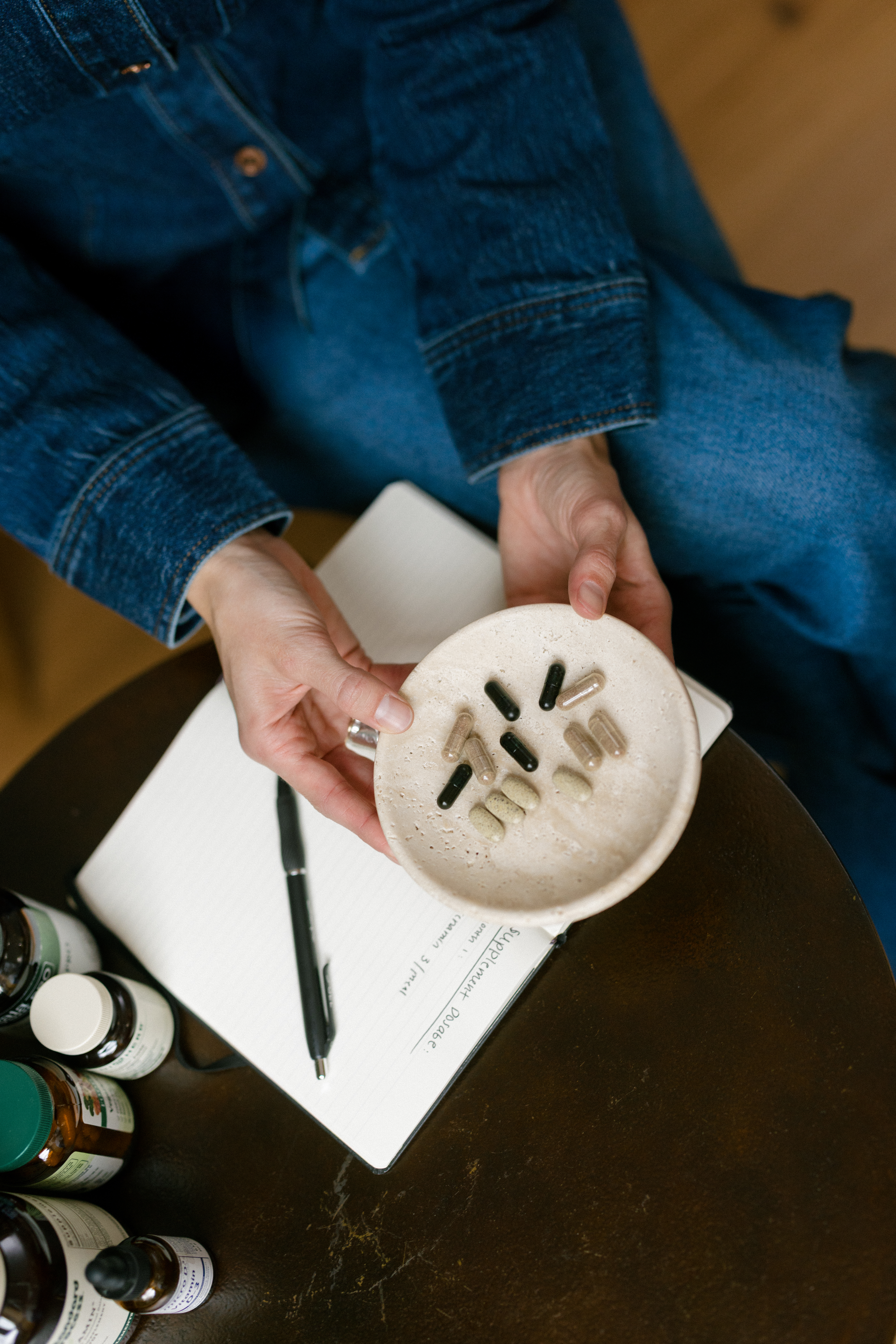 a nutritionist holding supplements