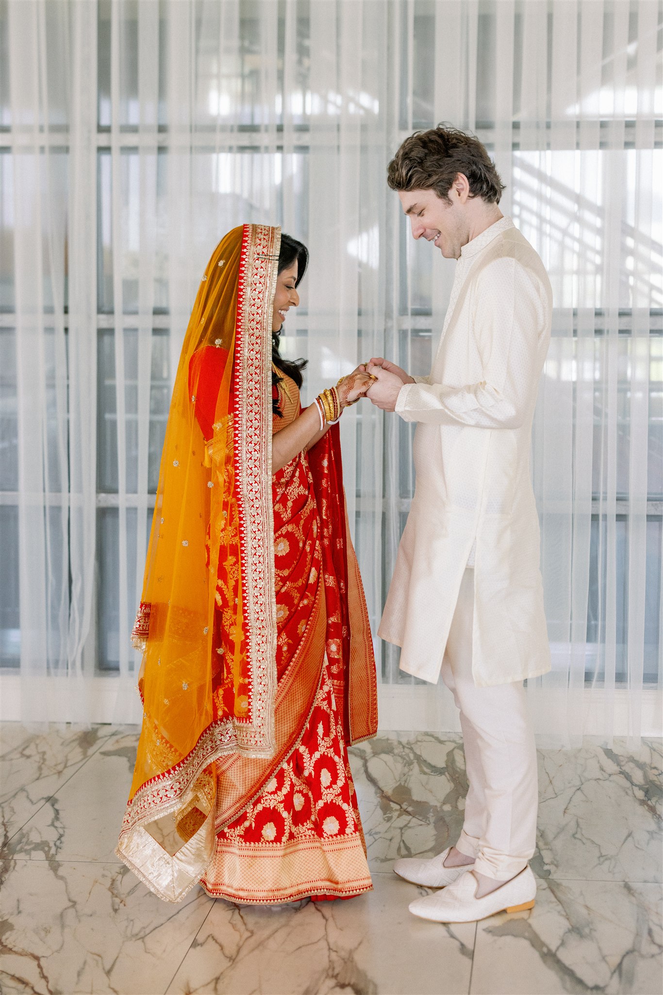 Bride and groom first look before their Indian fusion wedding
