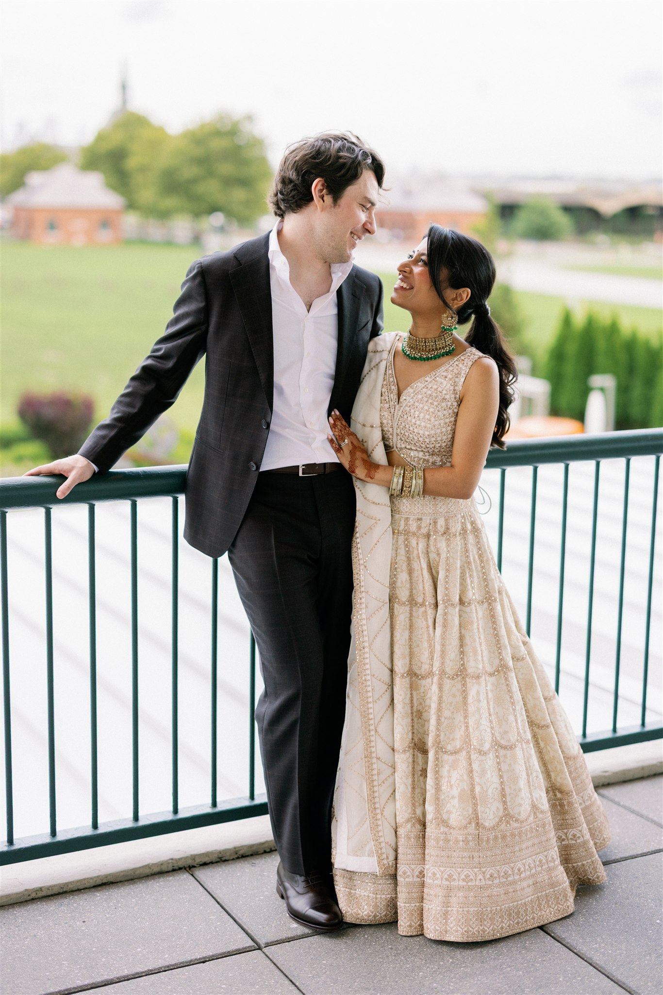 Bride and groom outfit change for their Indian fusion wedding reception