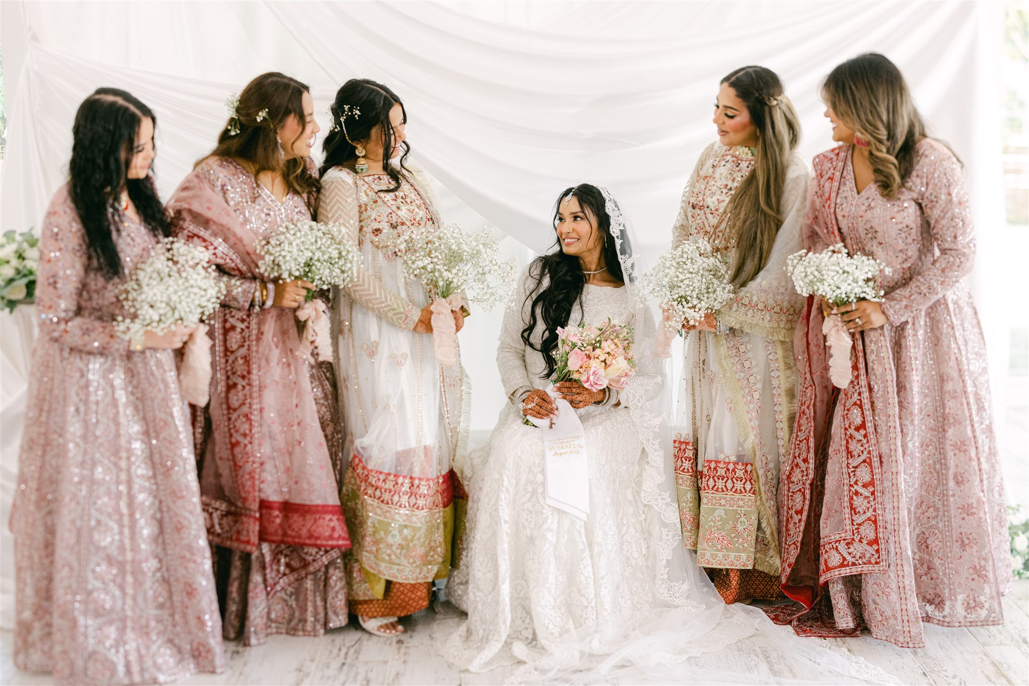 An Indian bride with her bridesmaids