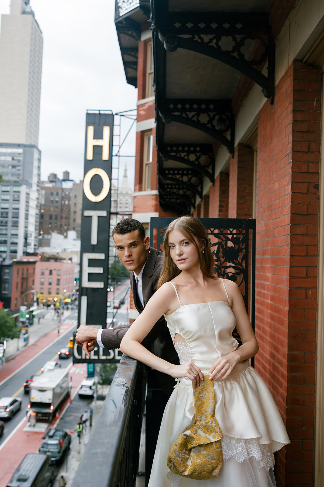 Bride and groom portraits during their welcome party on their balcony at Hotel Chelsea in NYC
