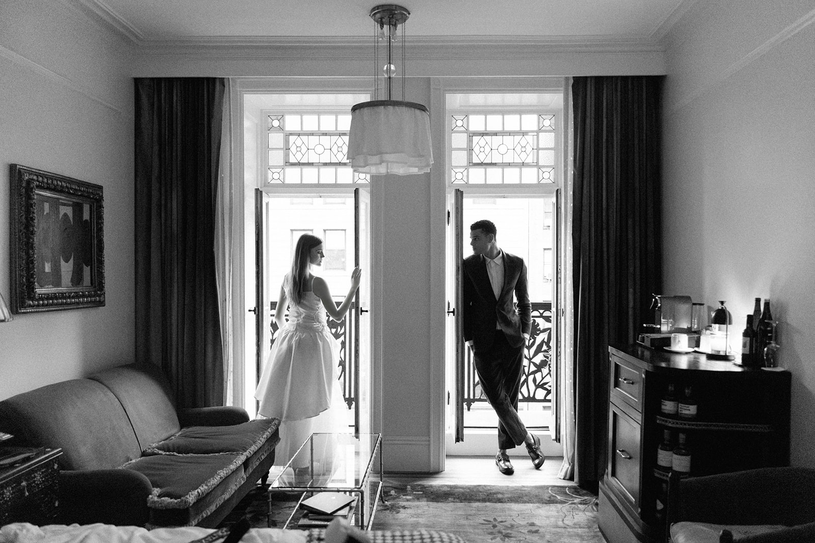 Bride and groom portraits during their welcome party on their balcony at Hotel Chelsea in NYC