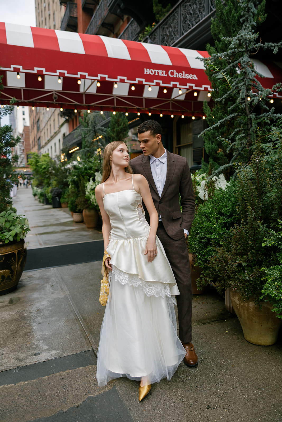 Bride and groom outside of the Hotel Chelsea in manhattan new york