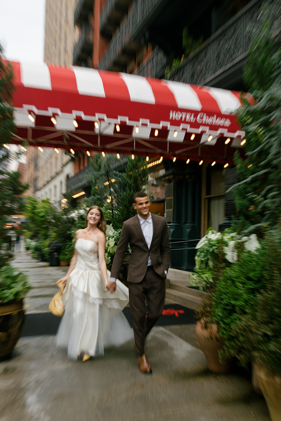 Bride and groom outside of the Hotel Chelsea in manhattan new york