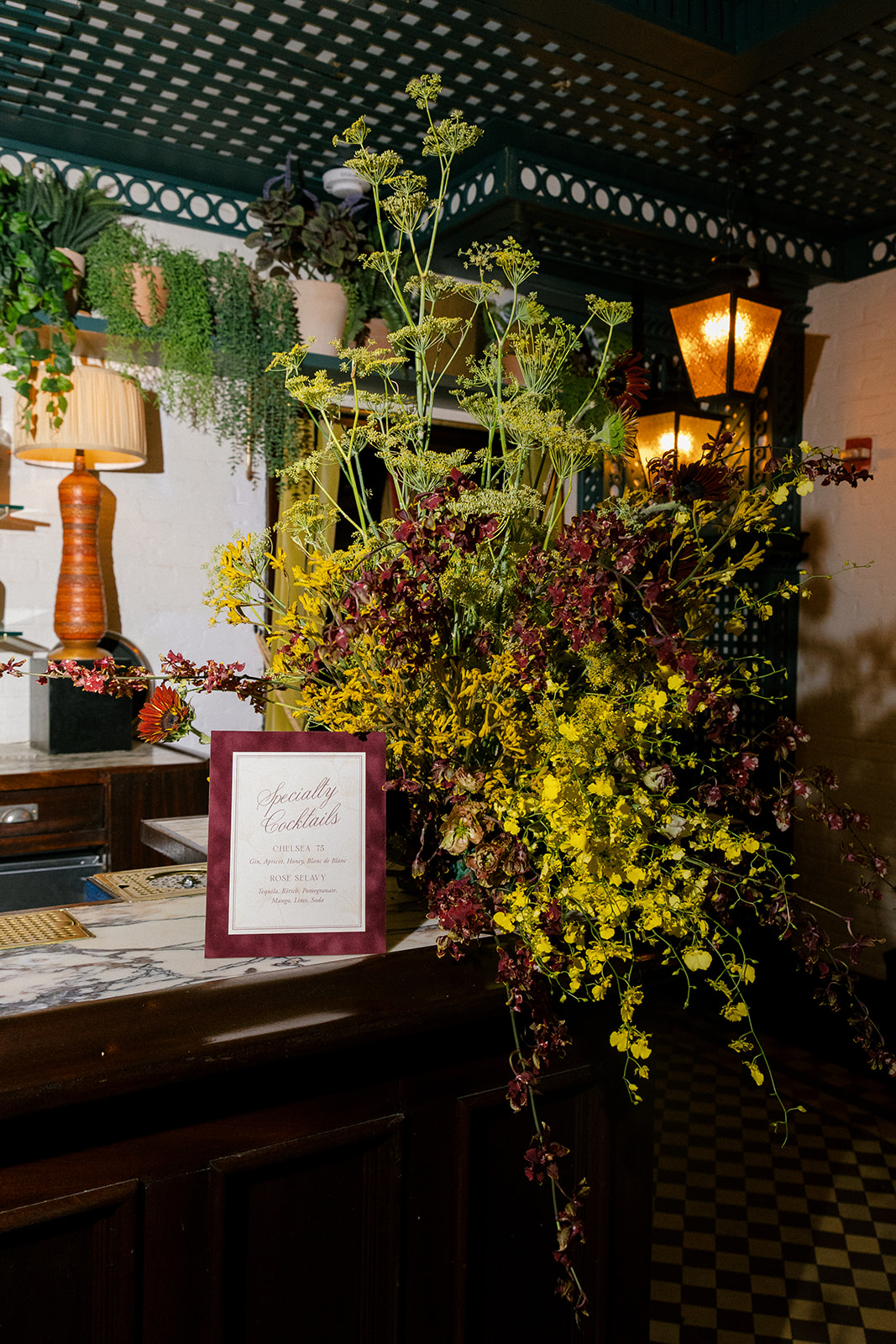 Colorful floral arrangement on the bar for a welcome party at Hotel Chelsea in Manhattan