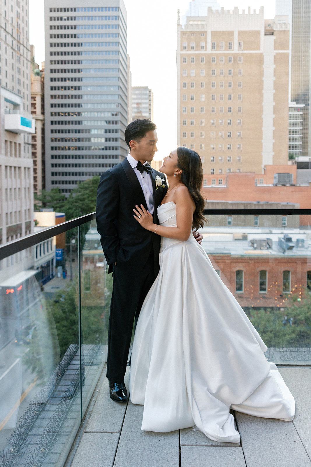 wedding couple portraits in downtown dallas at the mirador restaurant on the balcony