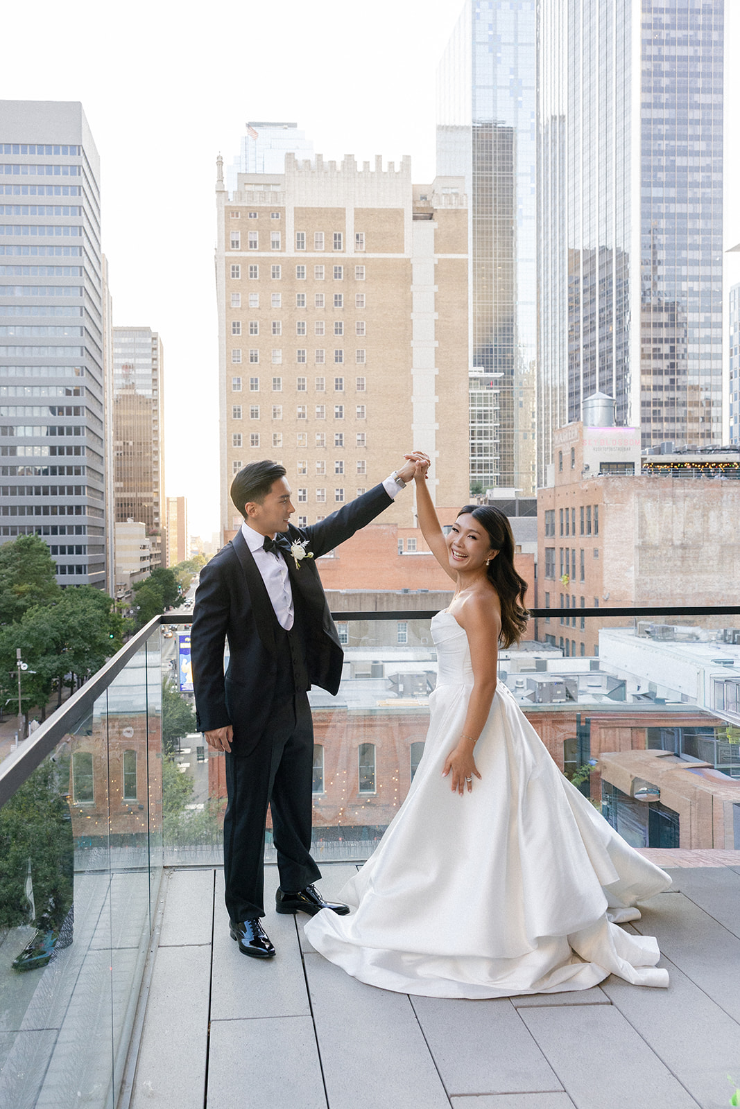 wedding couple portraits in downtown dallas at the mirador restaurant on the balcony
